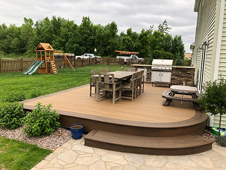 Trex Deck with an Outdoor Kitchen and Paver Patio